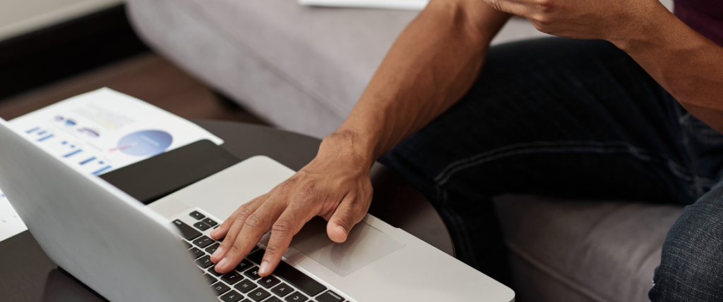 hand-on-laptop-trackpad